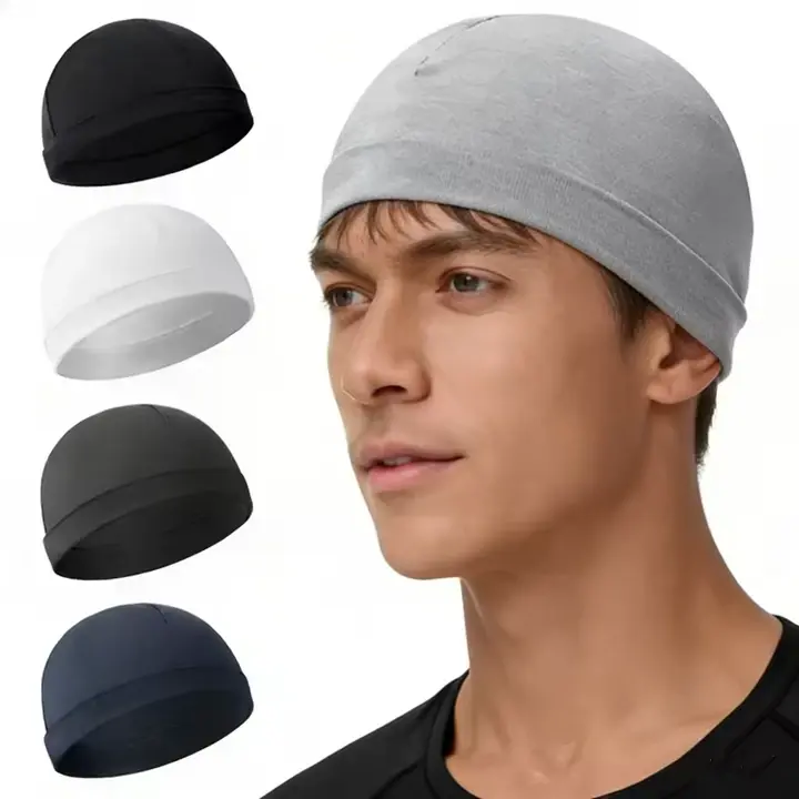 Gray close fitting skull cap beanie worn on a model