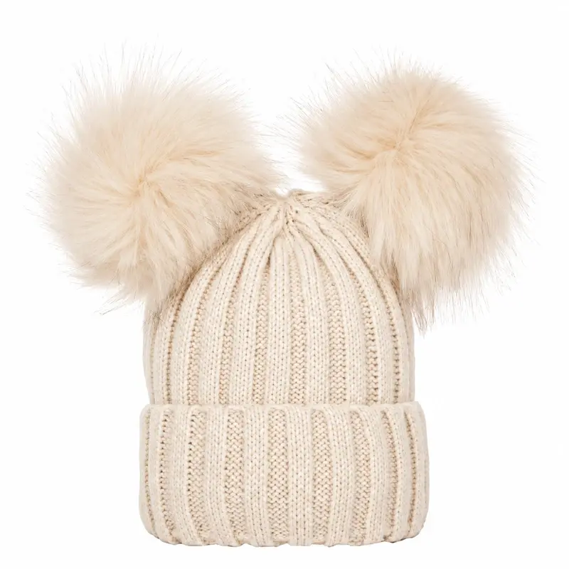 Ivory rib-knit beanie with two cream pom-poms and a folded cuff