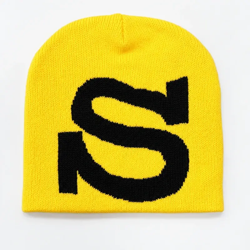 Yellow rib-knit short beanie with a dense black embroidered S mark