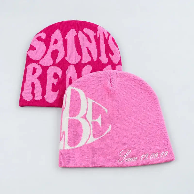 Pink short beanies showing embroidered lettering and logo examples
