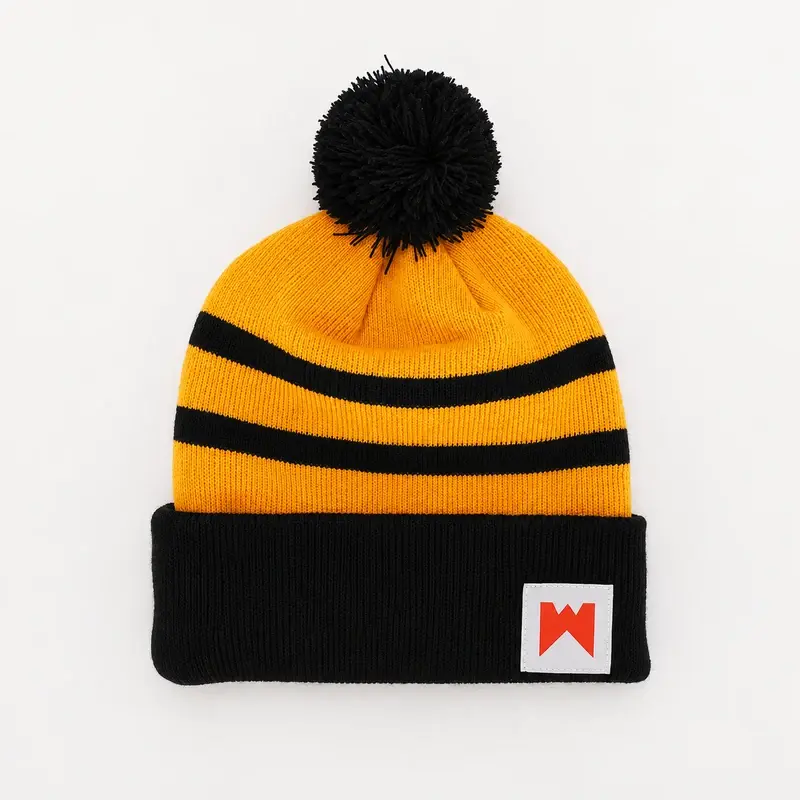 Black and golden-yellow rib-knit beanie with a compact yarn pom