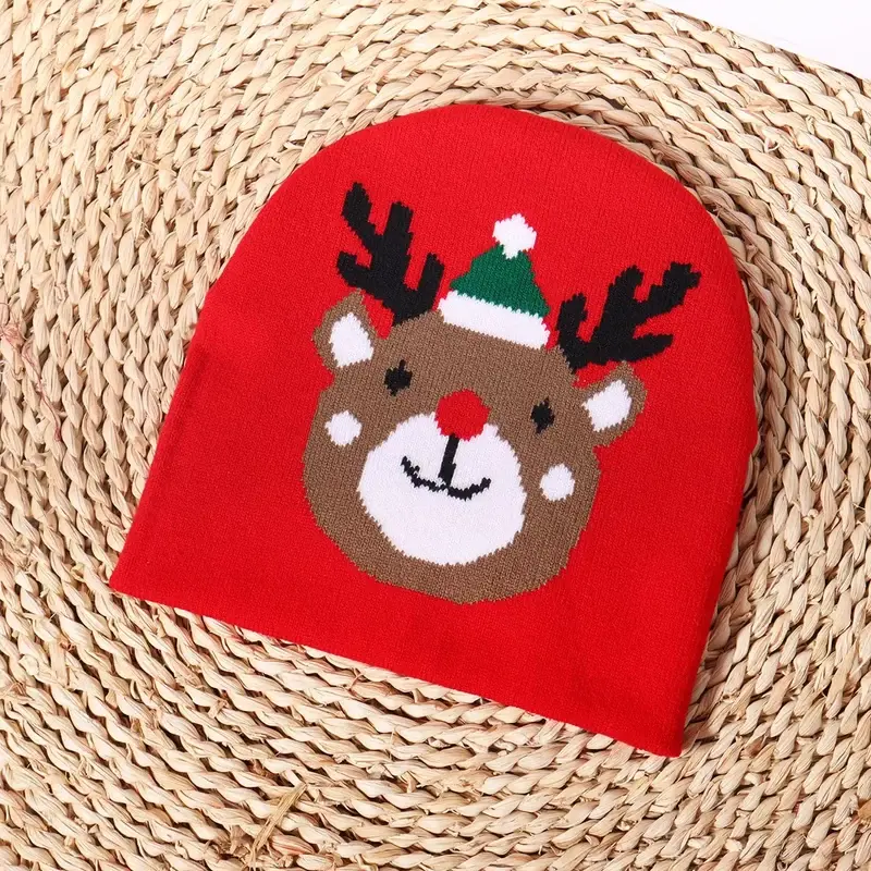 Red knit beanie with a reindeer pattern