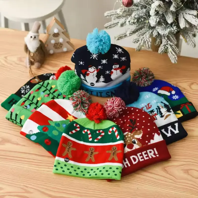 Christmas knit beanies with snowman and winter motifs arranged on a wooden table