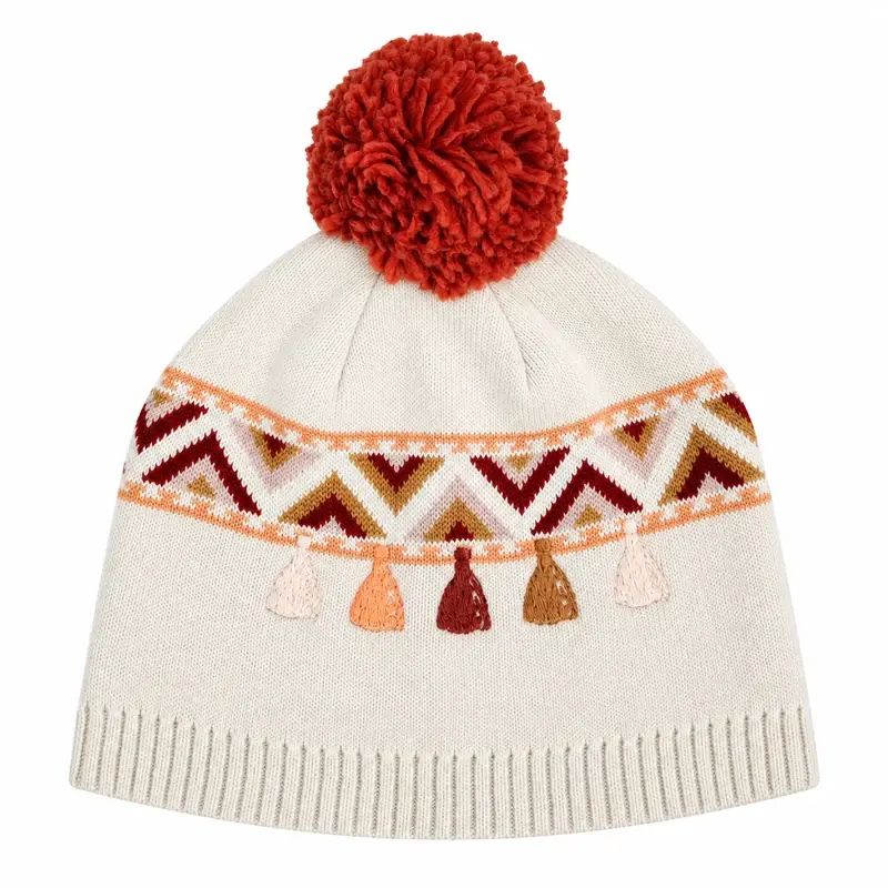 White jacquard pom-pom beanie with a repeated geometric band and hanging motifs