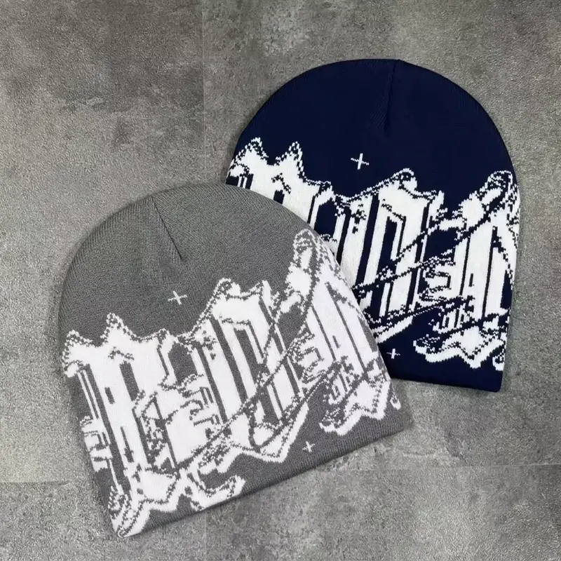 Two knit beanies with repeating skyline jacquard motifs