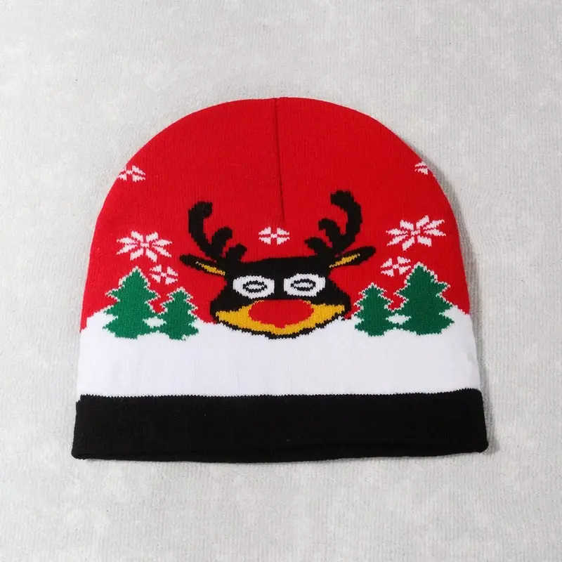 Red Christmas beanie with reindeer, trees and snowflakes