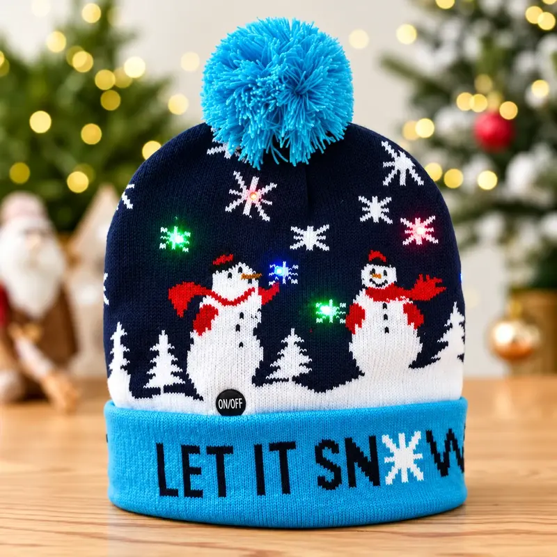 Navy LED snowman beanie with a turquoise pom and cuff