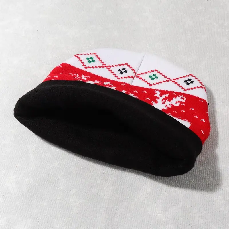 Inside view of a red and white Christmas knit beanie showing its patterned band and edge