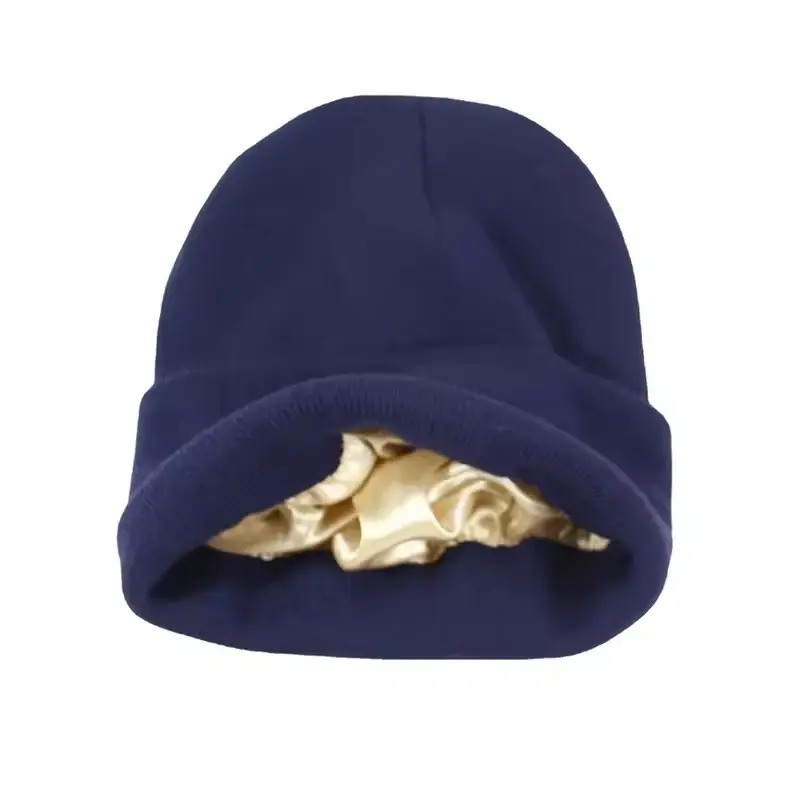 Navy knit beanie with its inner layer visible at the opening