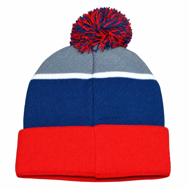 Blue and gray knit beanie with a red and blue yarn pom and red cuff