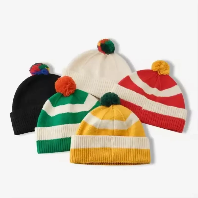 Red, green, white and yellow Christmas color pom pom beanies