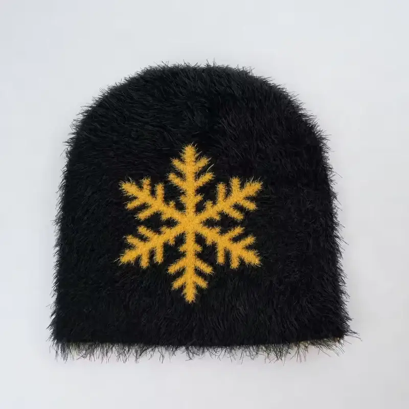 Black fuzzy beanie with a gold embroidered snowflake