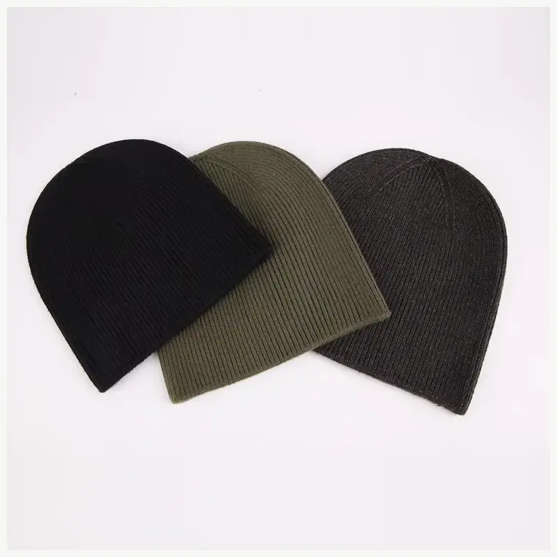 Overlapping black, olive, and charcoal cuffless beanies