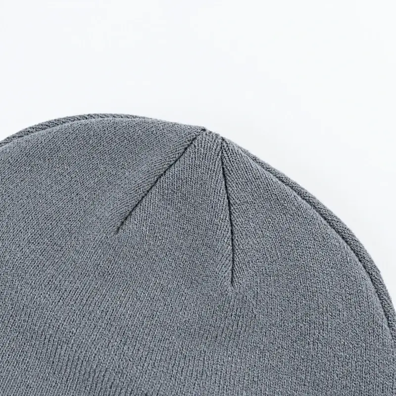 Close-up of the gray cuffless knit beanie crown and seam