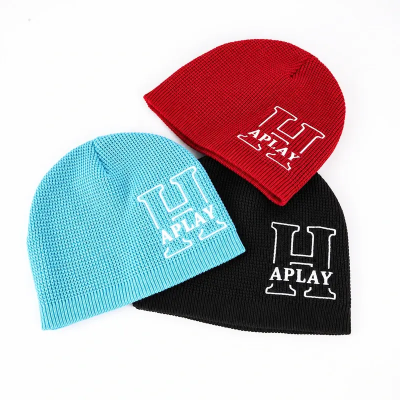 Red, light blue, and black ribbed cuffless beanies with printed designs