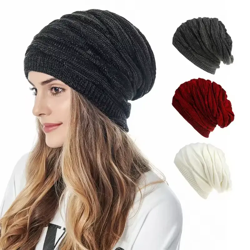 Model wearing a black relaxed slouchy knit beanie