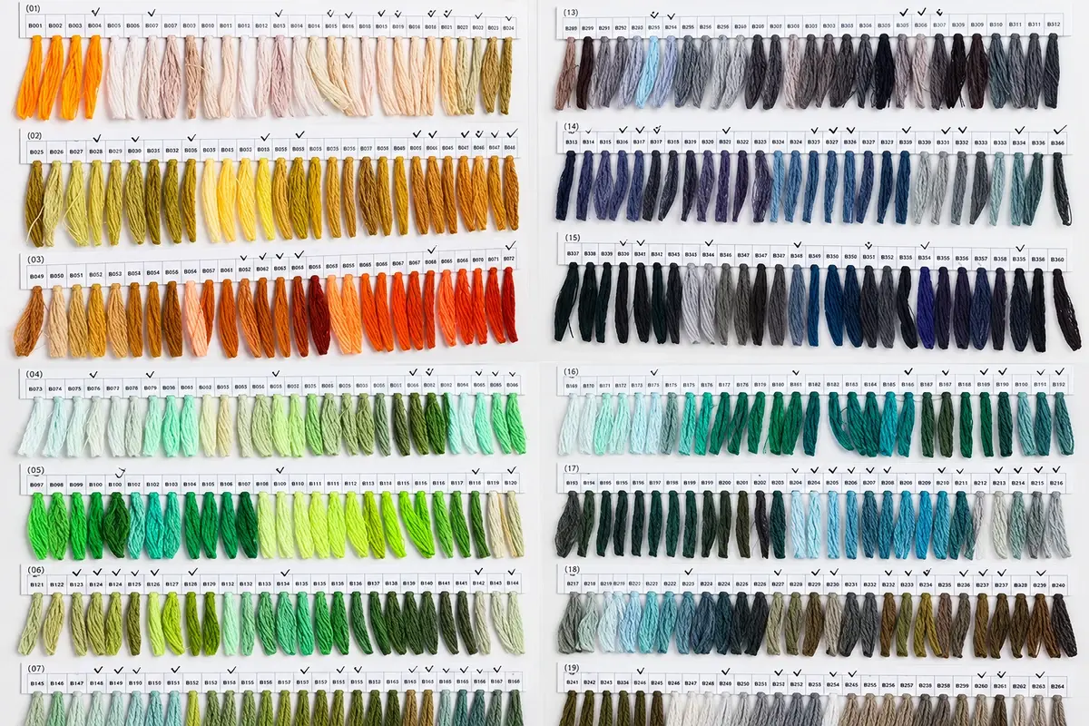 Rows of yarn swatches arranged by color for material selection