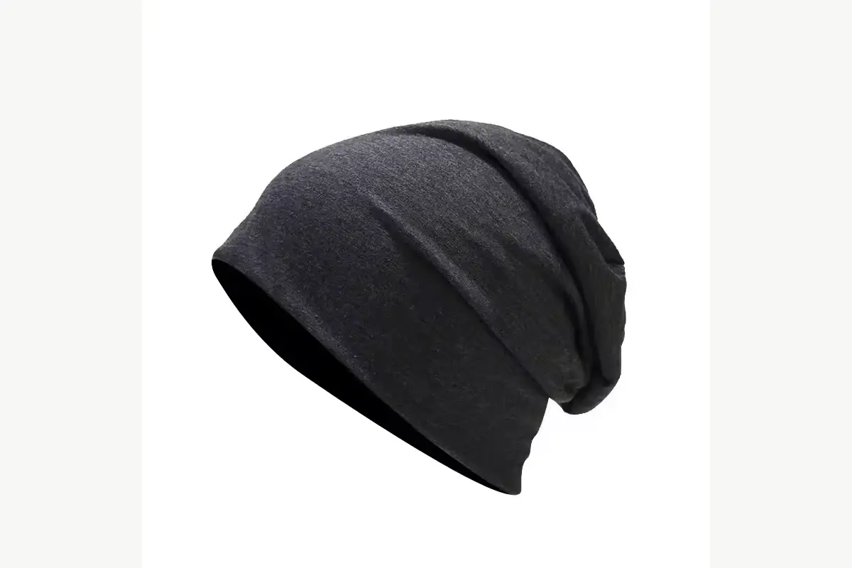Black slouchy knit beanie shown in side profile