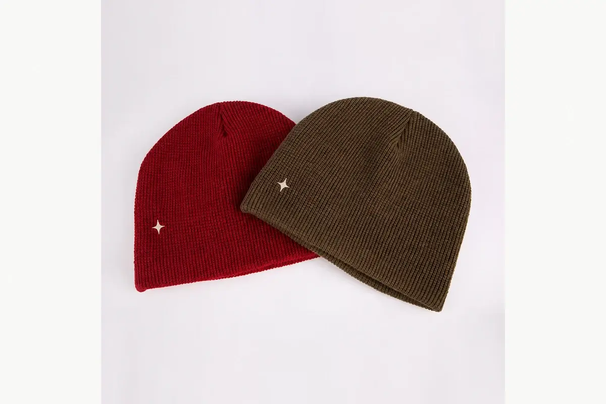Red and olive knit beanies with small neutral star marks