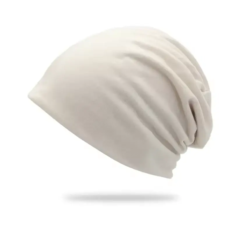 Beige oversized slouchy knit beanie shown from the side