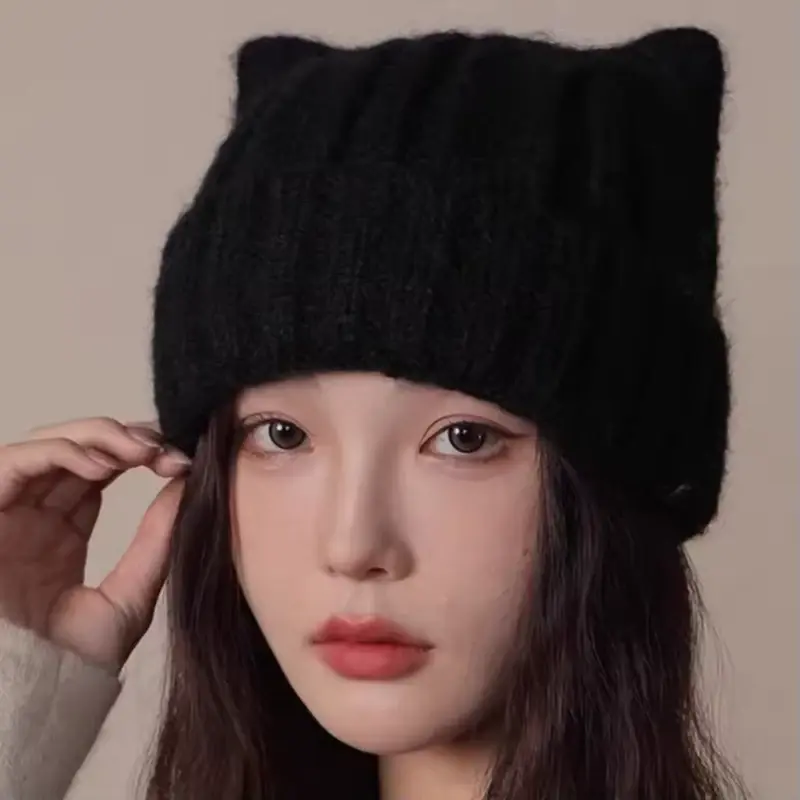 Black oversized rib-knit beanie worn by a model