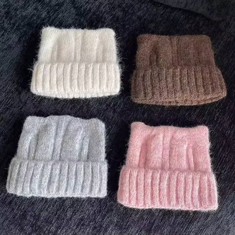 Chunky knit beanies shown in cream, taupe, gray and pink