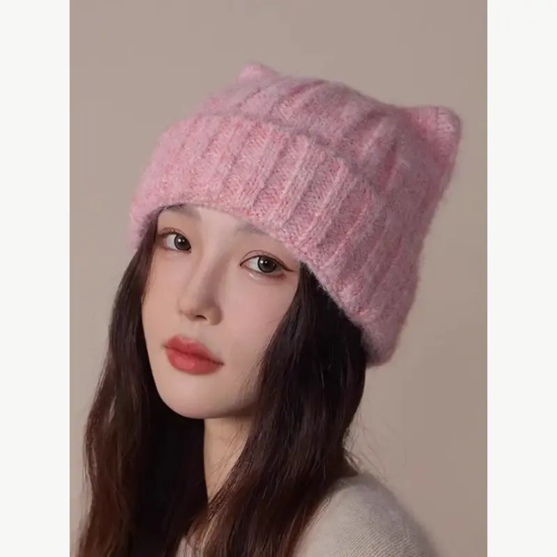 Pink chunky knit beanie worn with a soft crown