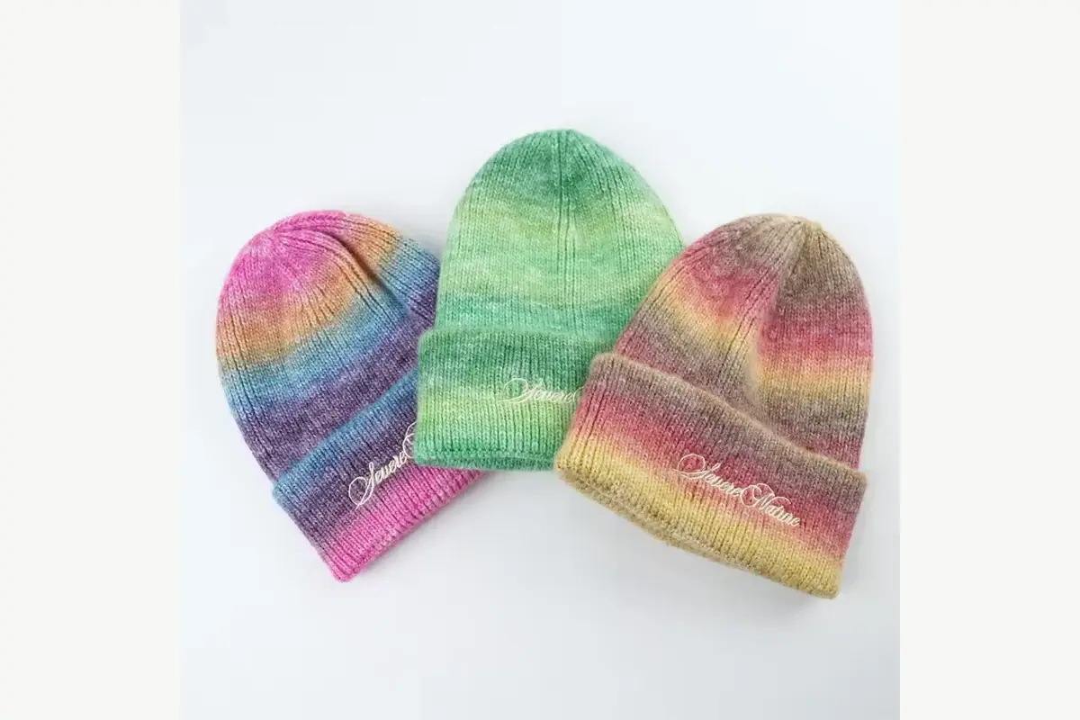Striped knit beanies arranged in different color patterns