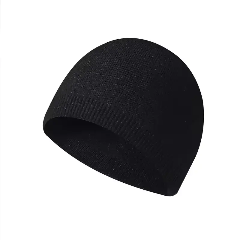 Plain black cuffless knit beanie on a light background