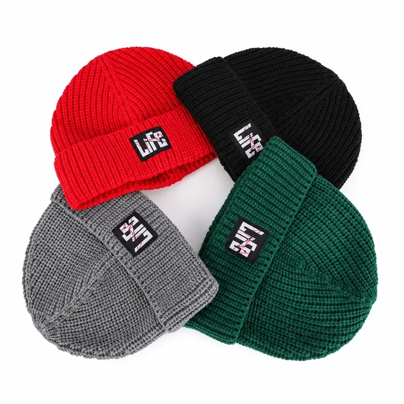 Four short ribbed fisherman beanies with square patches