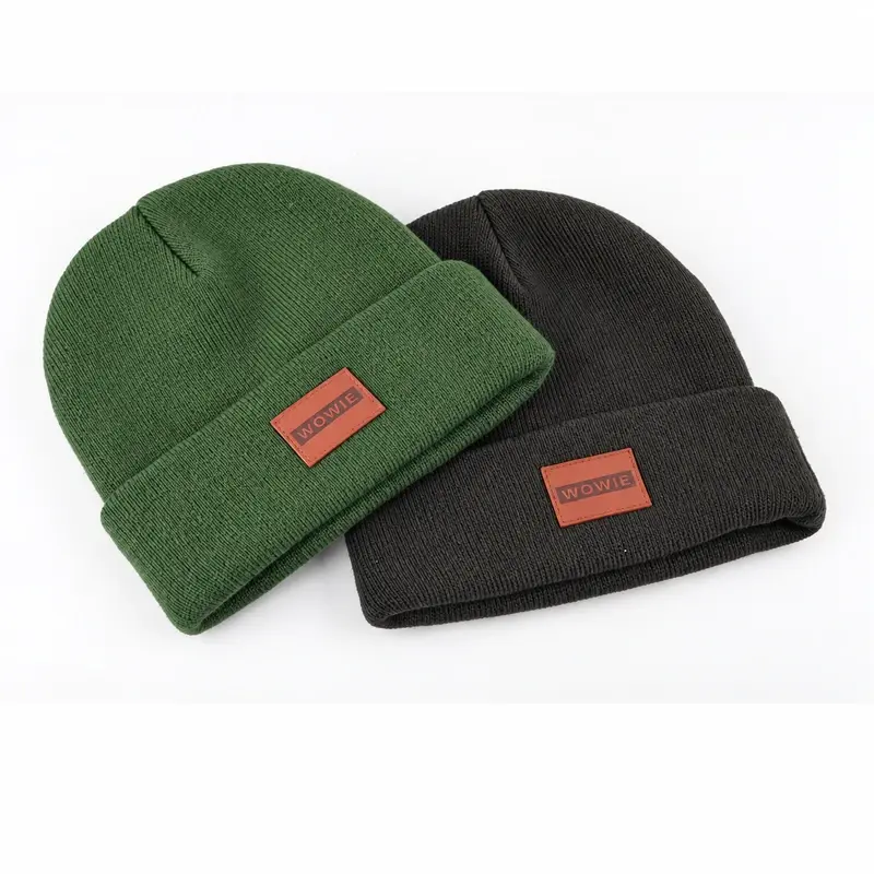 Green and charcoal short cuffed fisherman beanies with woven patches