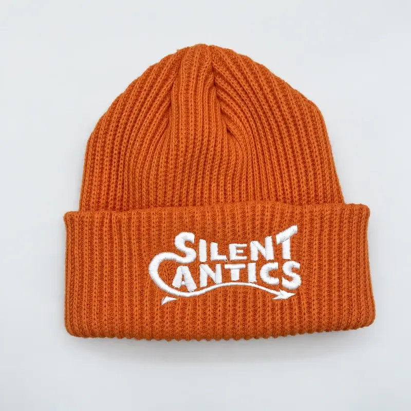 Orange ribbed cuffed beanie with white embroidered lettering, shown from the front