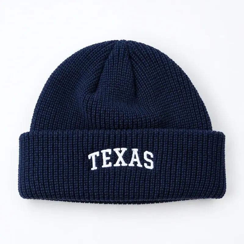 Navy ribbed cuffed beanie with TEXAS lettering, shown from the front
