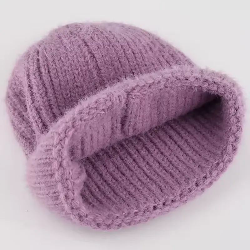 Lavender chunky knit beanie angled to show the folded cuff and inside