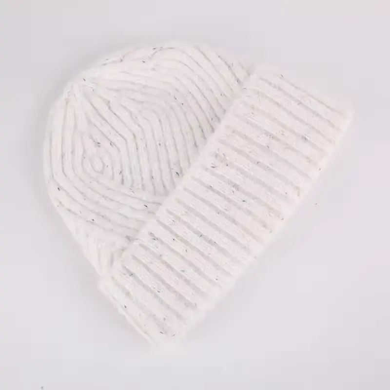 White rib-knit cuffed beanie on a light background