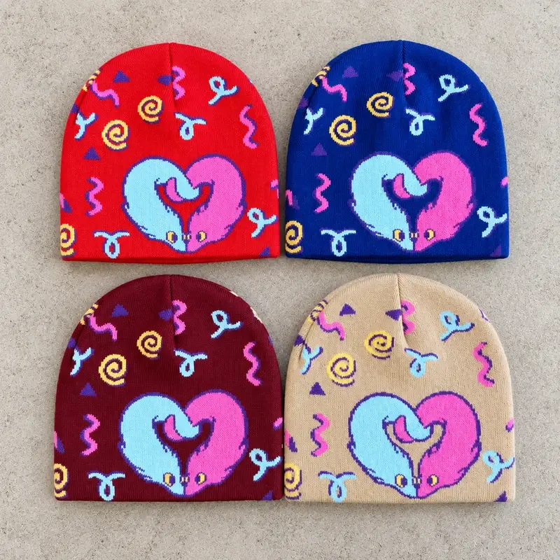 Four full-front cuffless beanies in contrasting colors with playful knit motifs