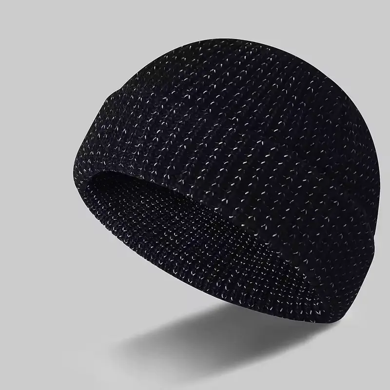 Low-profile black knit skull cap shown at an angle