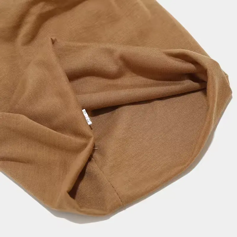 Brown knit beanie turned to show its inner construction