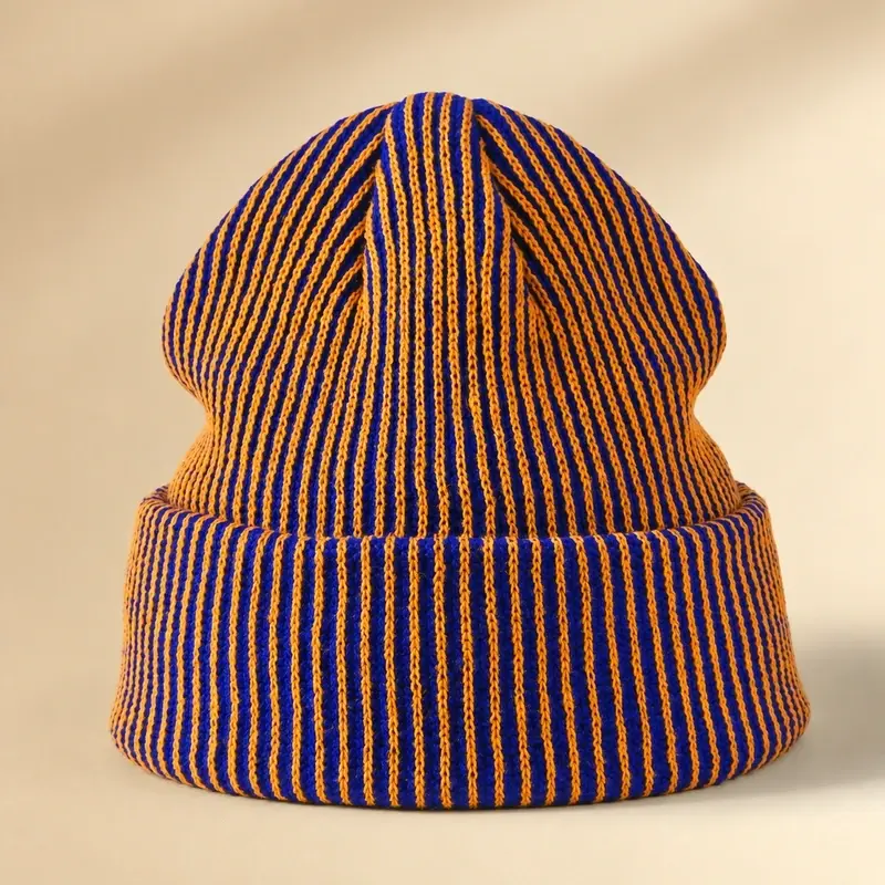 Blue and orange striped ribbed fisherman beanie with folded cuff, front view
