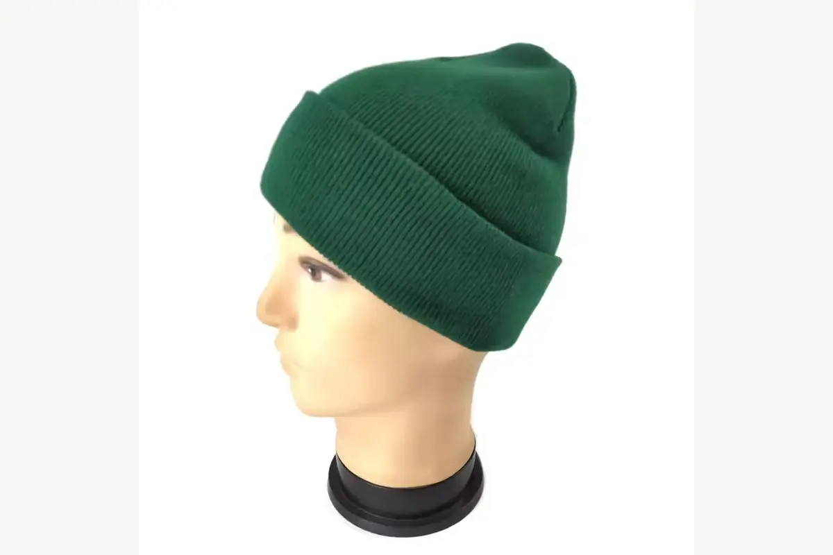 Green short ribbed beanie on a mannequin, shown in side profile