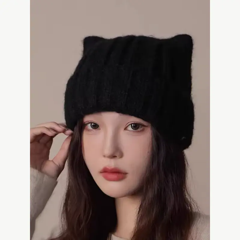 Black ribbed slouchy beanie worn by a model