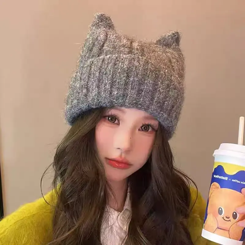 Gray textured slouchy beanie worn by a model