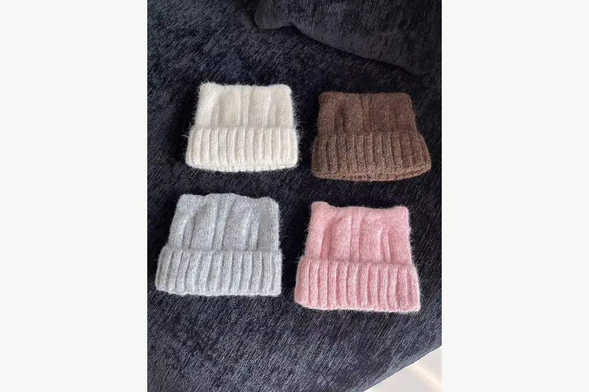 Four ribbed knit beanies showing variations in texture and color