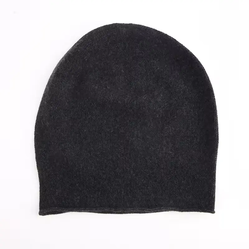 Plain black low-profile knit skull cap, front view