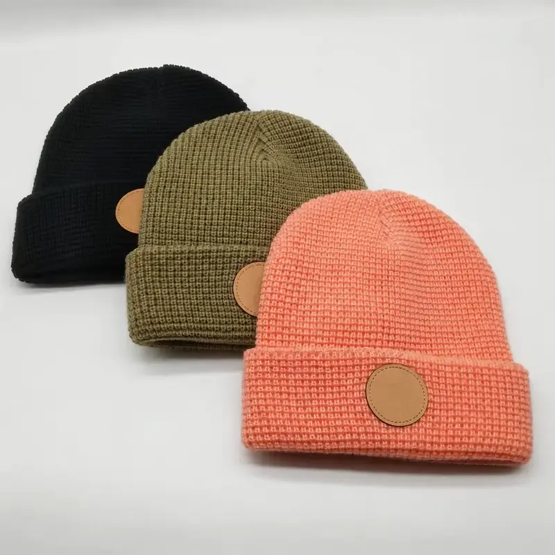 Black, olive and coral waffle-knit cuffed beanies with plain round patches