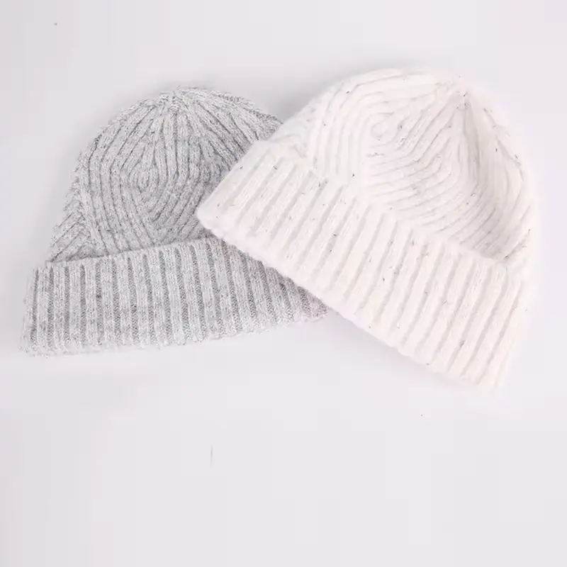 Cream and gray thick-knit beanies with folded cuffs
