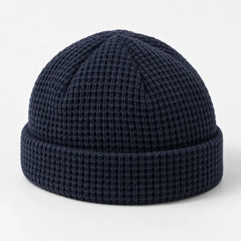 Navy waffle-knit fisherman beanie showing crown shaping