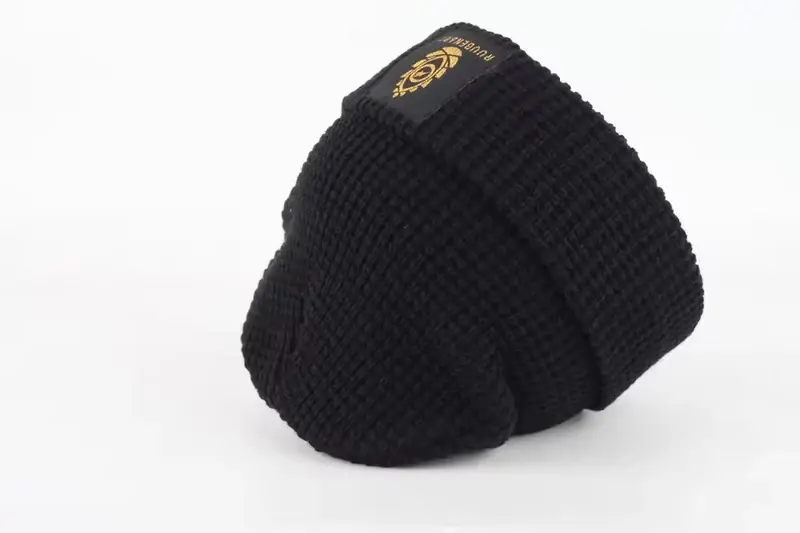 Black ribbed beanie with a gold rectangular label