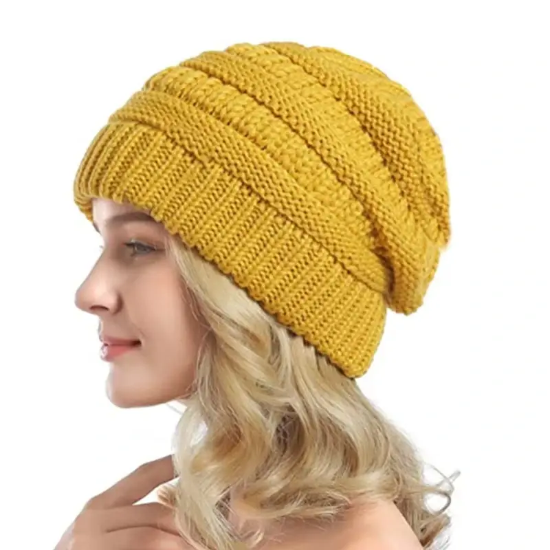 Yellow cable-knit slouchy beanie worn in side profile