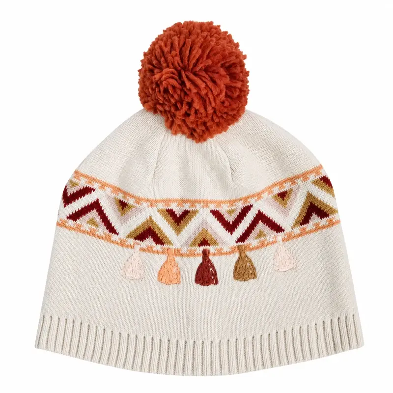 White beanie with geometric jacquard band and tan yarn pom-pom